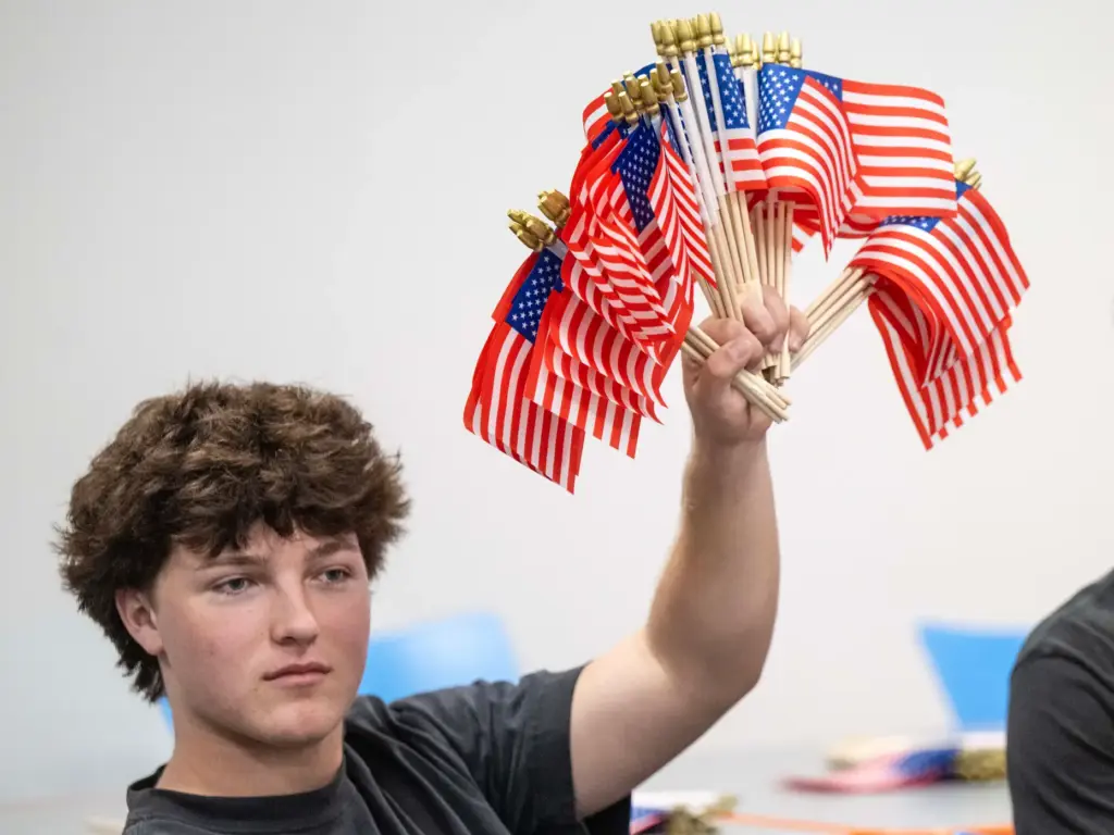 Dutch Stephens, a senior at Los Alamitos High School, holds...