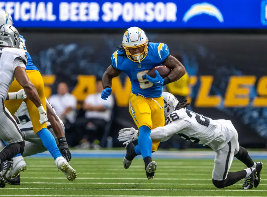 Chargers running back Omarion Hampton (8) carries the ball during...