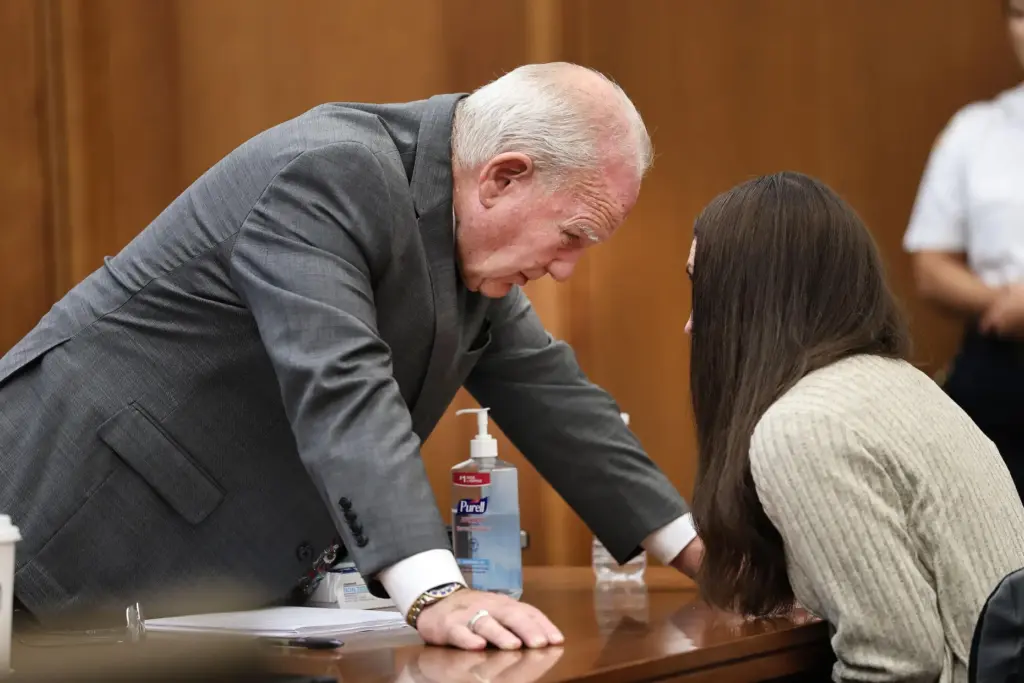 Defense attorney Kevin Reddington talks with Lindsay Clancy.