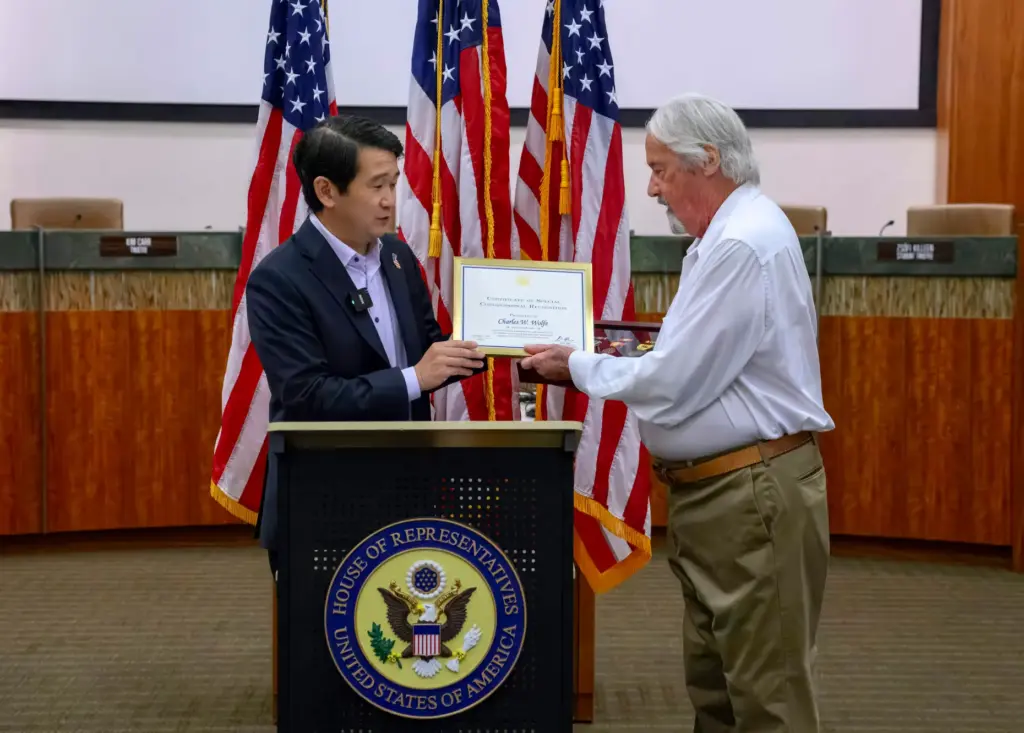 Congressman Dave Min of the 47th Congressional District presents Charles...