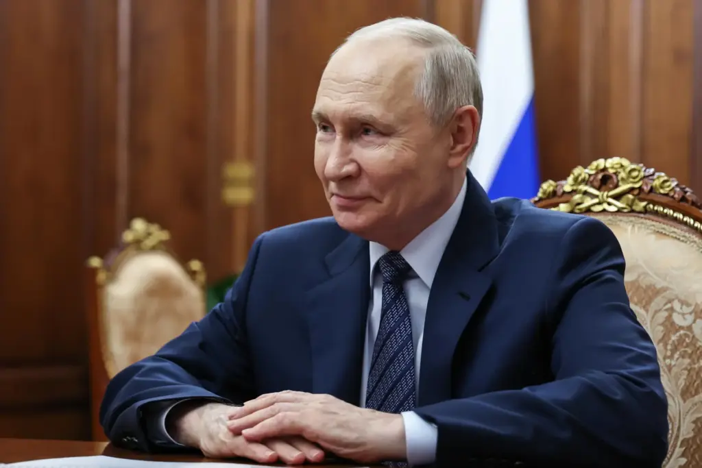 Russian President Vladimir Putin meets with Russian Federal Customs Service Valery Pikalev.