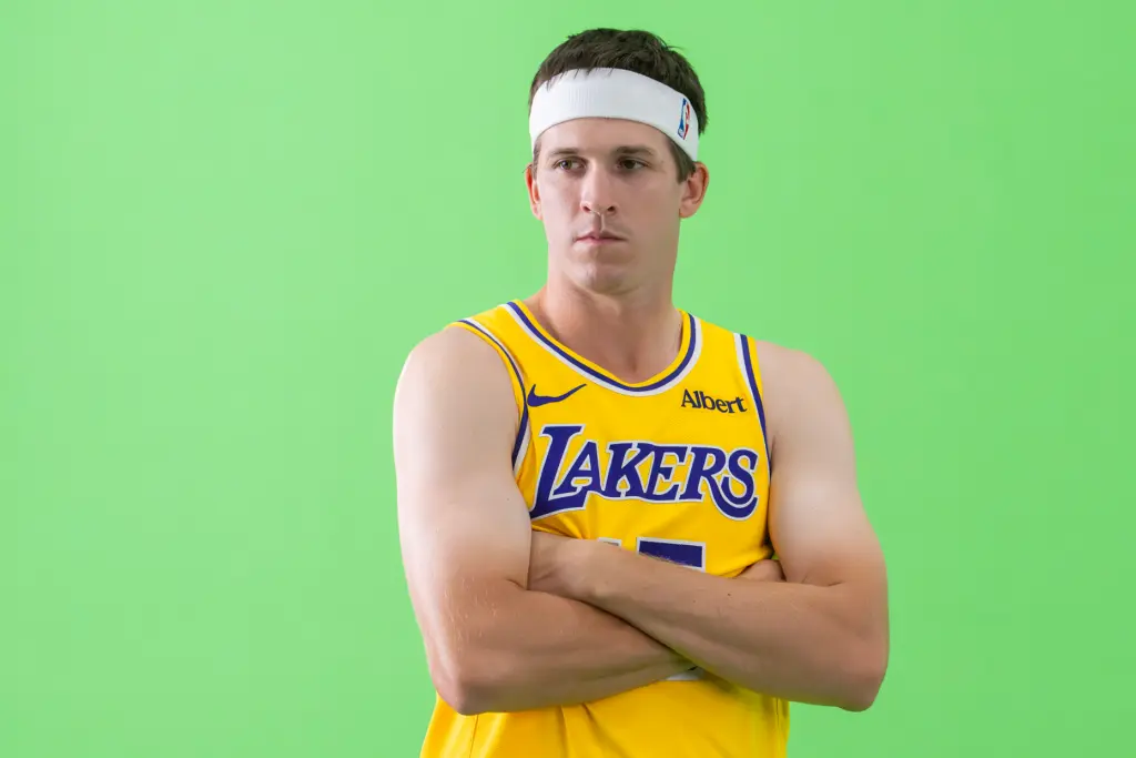 Lakers guard Austin Reaves poses for photographs during the team’s...