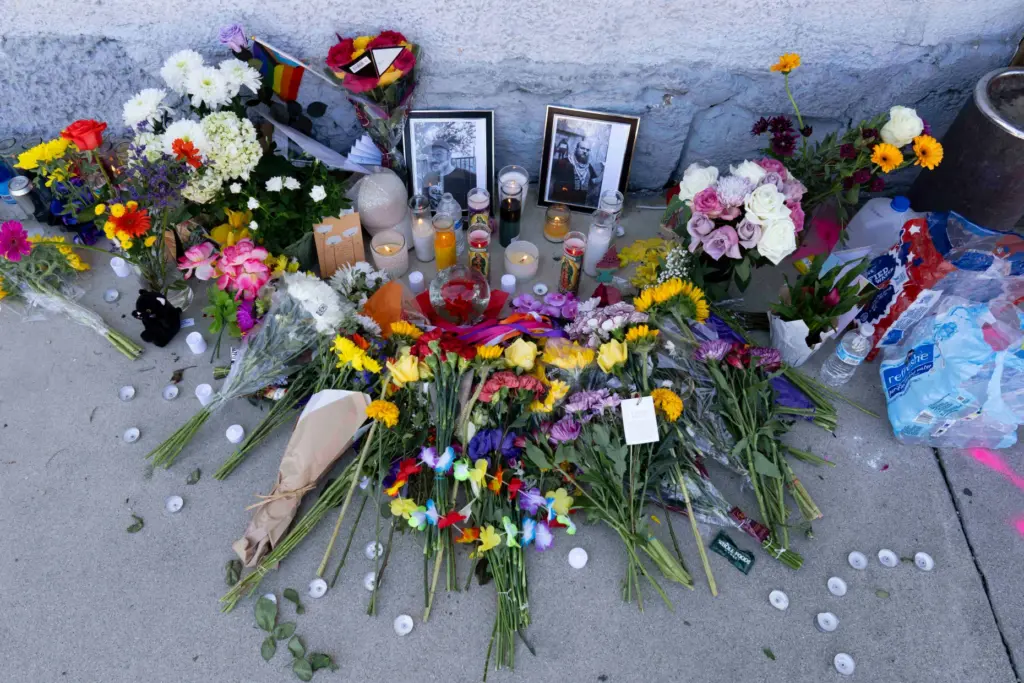 A growing memorial sits outside the Venture-N Bar in Tucson,...