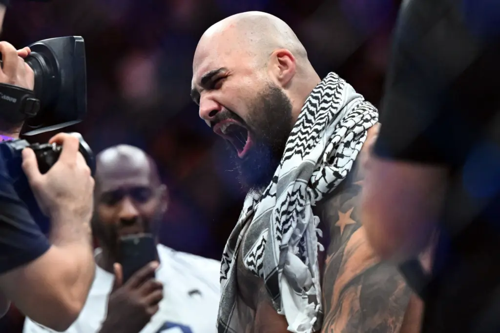 Sean Sharaf reacts after knocking out Gable Steveson in 12...
