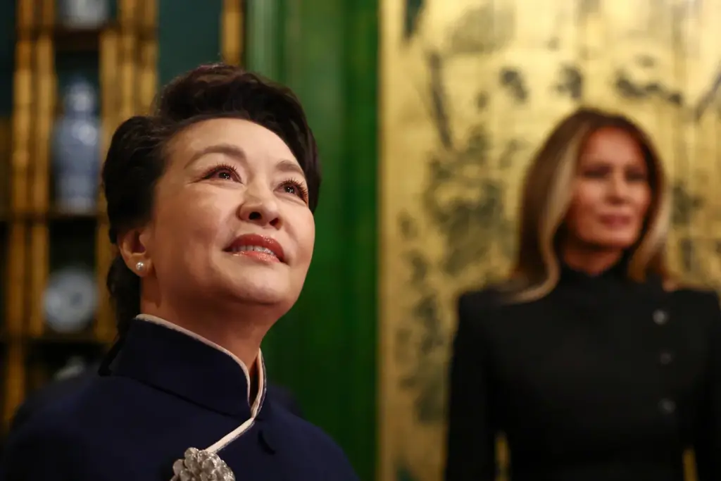 First lady of China Peng Liyuan, left, and first lady...