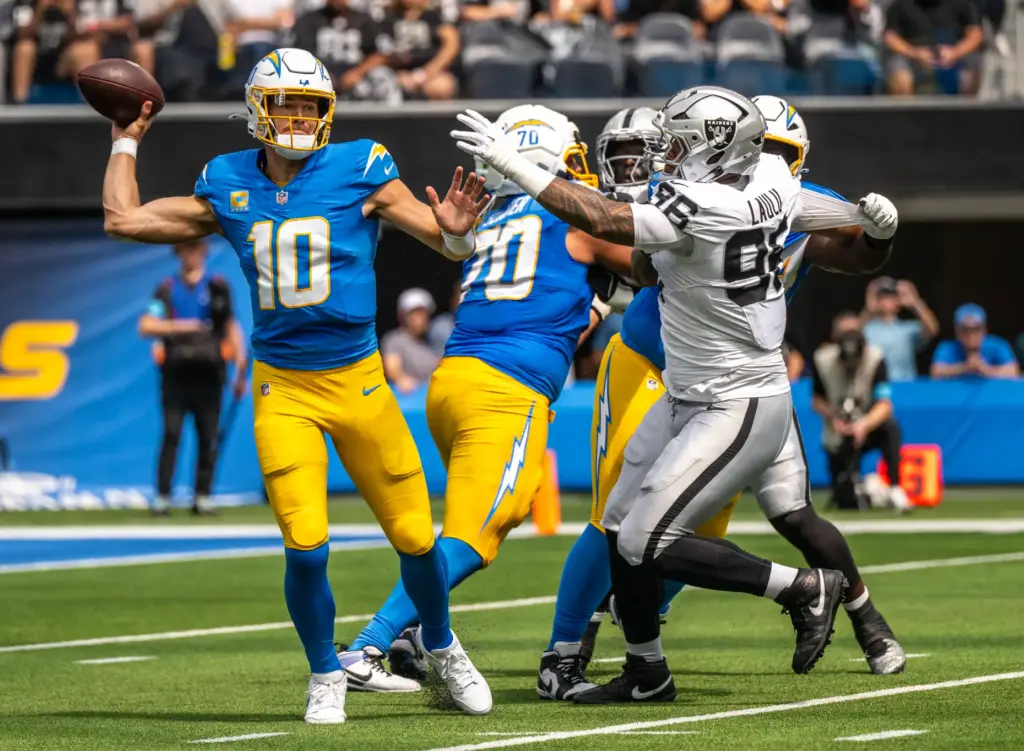 Chargers quarterback Justin Herbert (10) throws the ball during the...