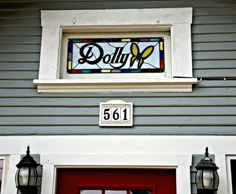 The decorative “Dolly” stained-glass window above the door. (Photo by...