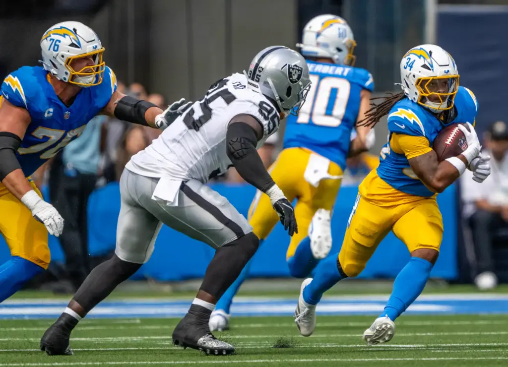 Chargers running back Keaton Mitchell (34) carries the ball during...