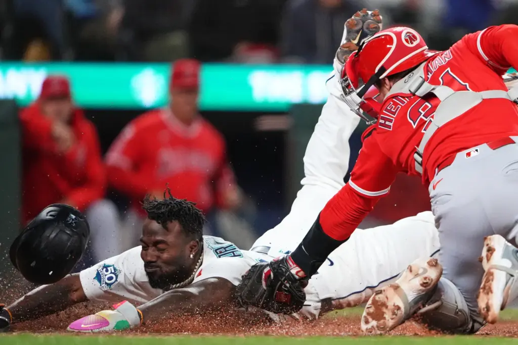 Seattle Mariners’ Randy Arozarena scores on an RBI fielder’s choice...