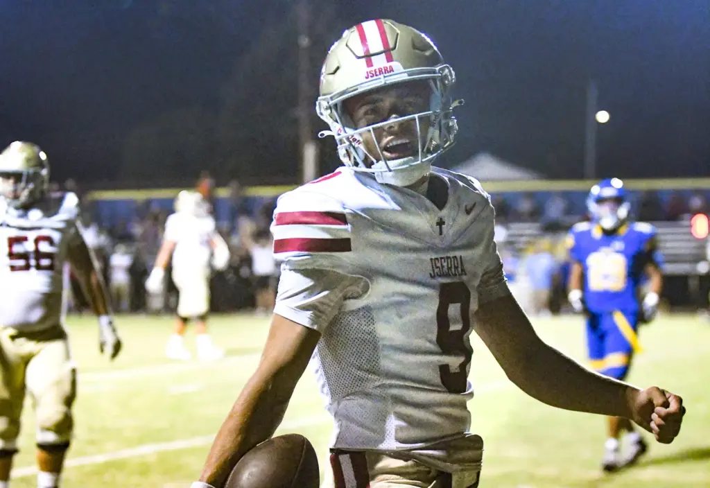 JSerra quarterback Hayes Cloutier (9) celebrates scoring a touchdown in...
