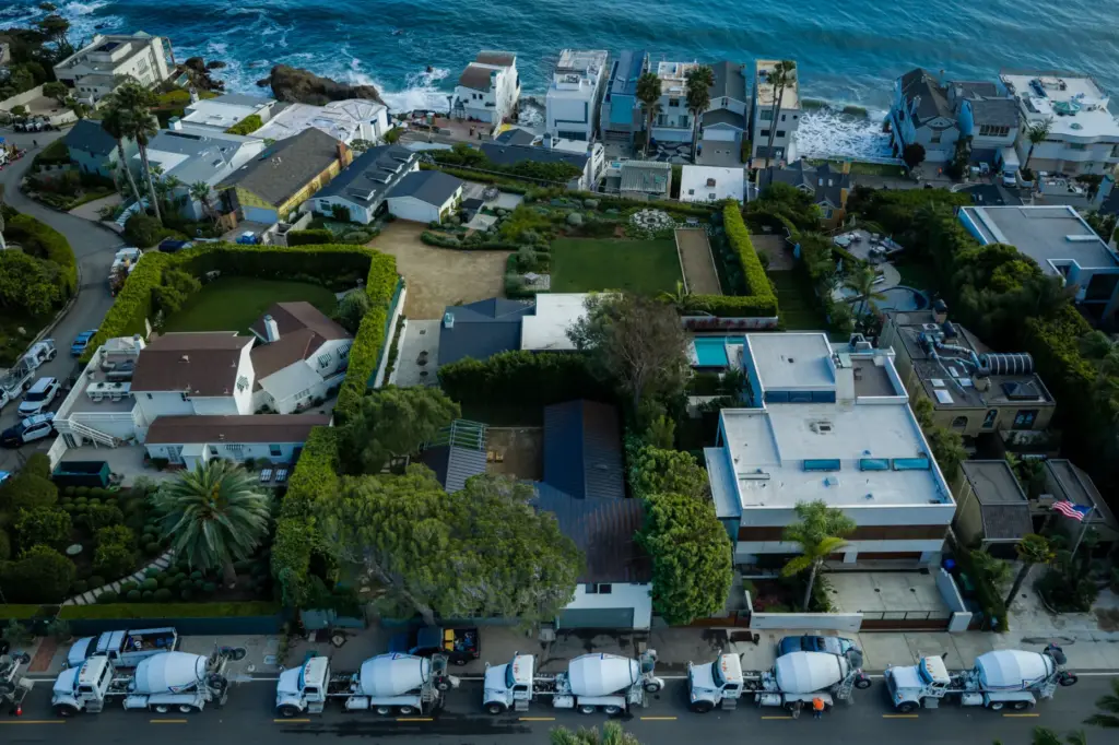 An aerial view construction vehicles lined up near a sinkhole...