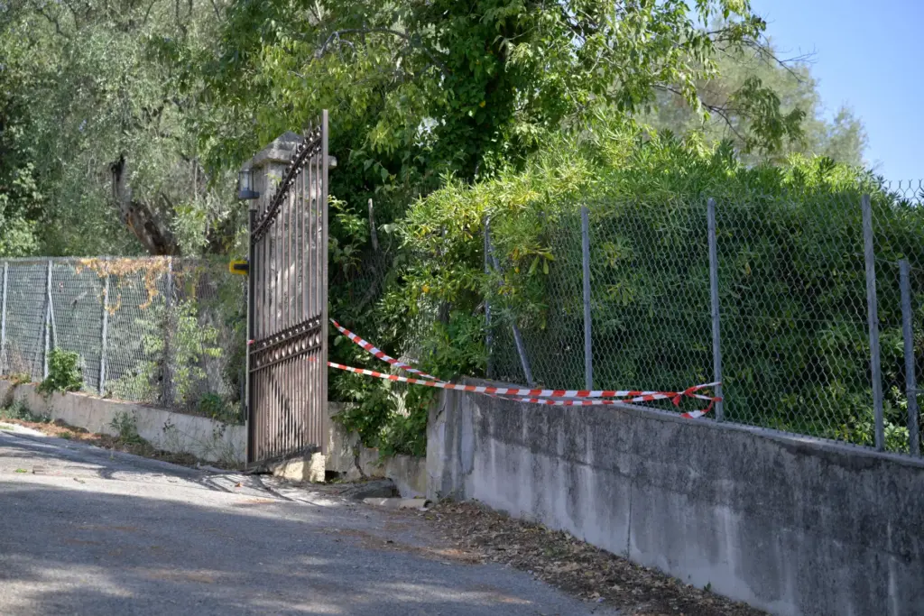 A barrier tape is set on the fence of the Renoir Museum.