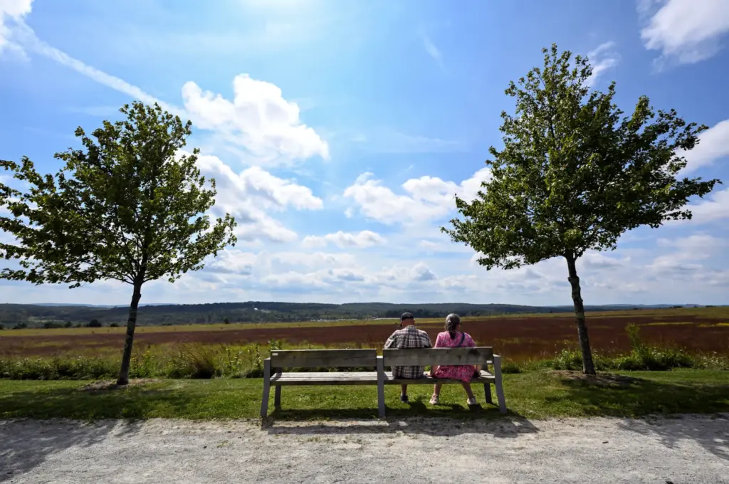 Hal Mante, and his wife, Joyce Mante, sit on a...