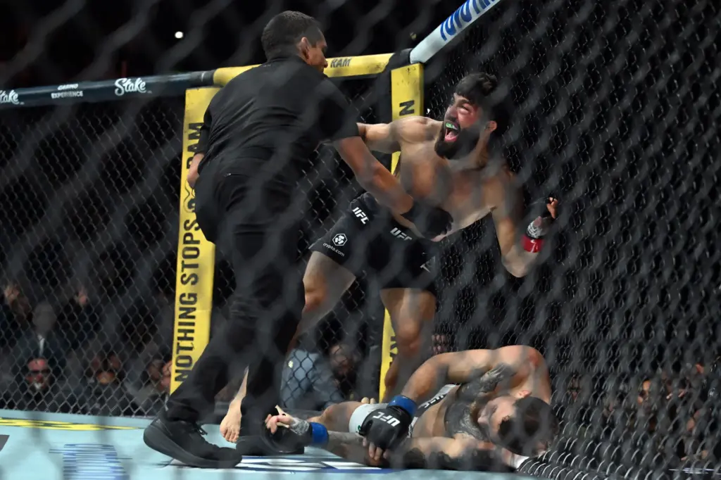 Arman Tsarukyan (red)knocks out Mauricio Ruffy (blue) during their fight...