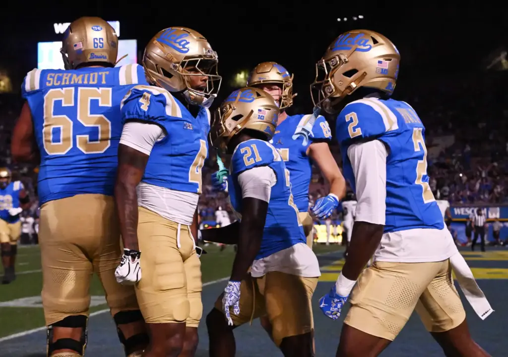 Wide receiver Semaj Morgan (4) of the UCLA Bruins celebrates...