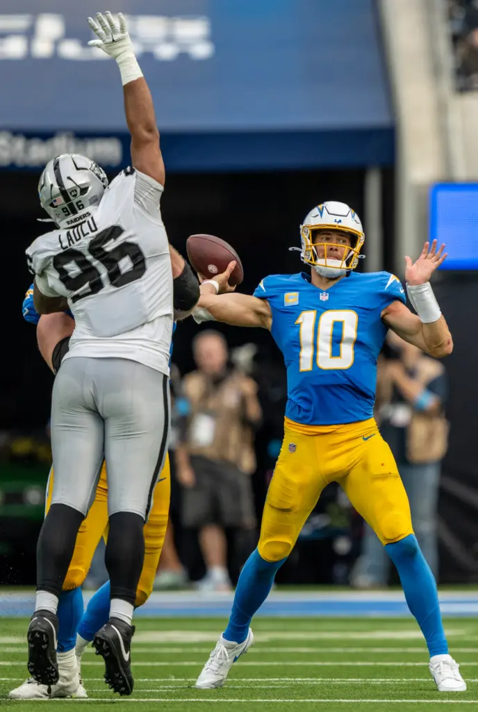 Chargers quarterback Justin Herbert (10) throws the ball during the...