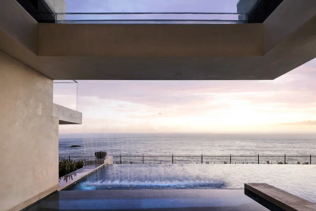 A glass-bottom spa appears to float from the second floor...