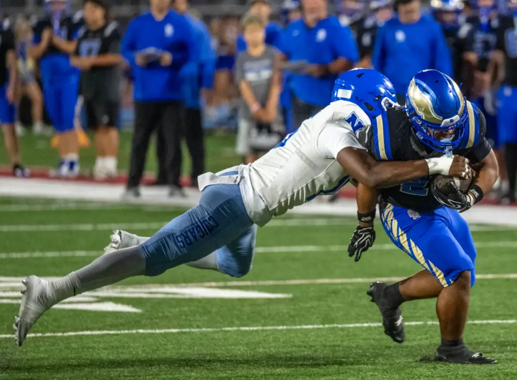 Santa Margarita running back Adrian Petero (26), right, breaks a...
