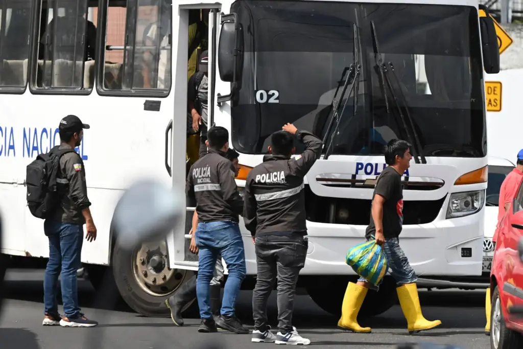 Crew members from the boat Maria Candelaria arrive at a police facility in Manta, Ecuador.