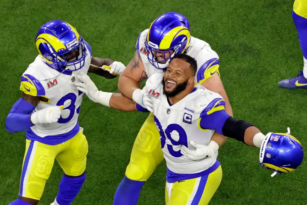 Rams defensive lineman Aaron Donald (99) celebrates after sacking Cincinnati...