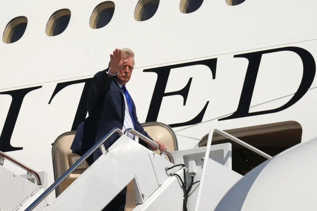 President Donald Trump boards Air Force One after an emergency...