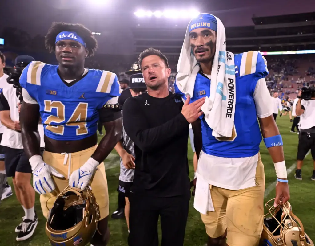 Head coach Bob Chesney with quarterback Nico Iamaleava (9) of...