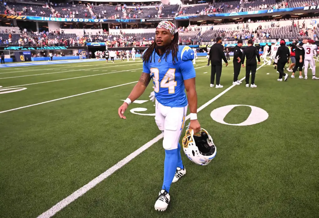 Chargers running back Keaton Mitchell (34) walks off the field...
