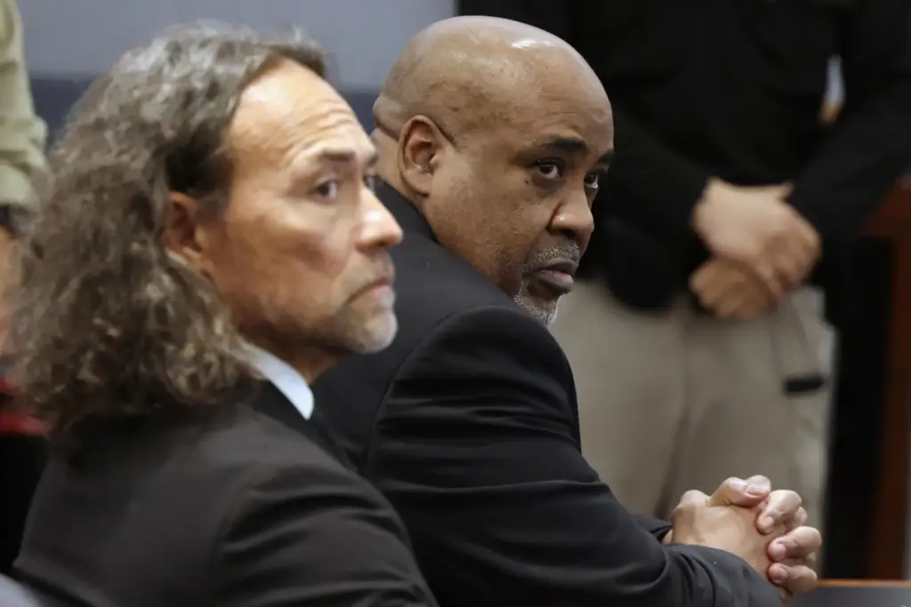 Duane Davis, right, and his attorney Michael Sanft sit in...