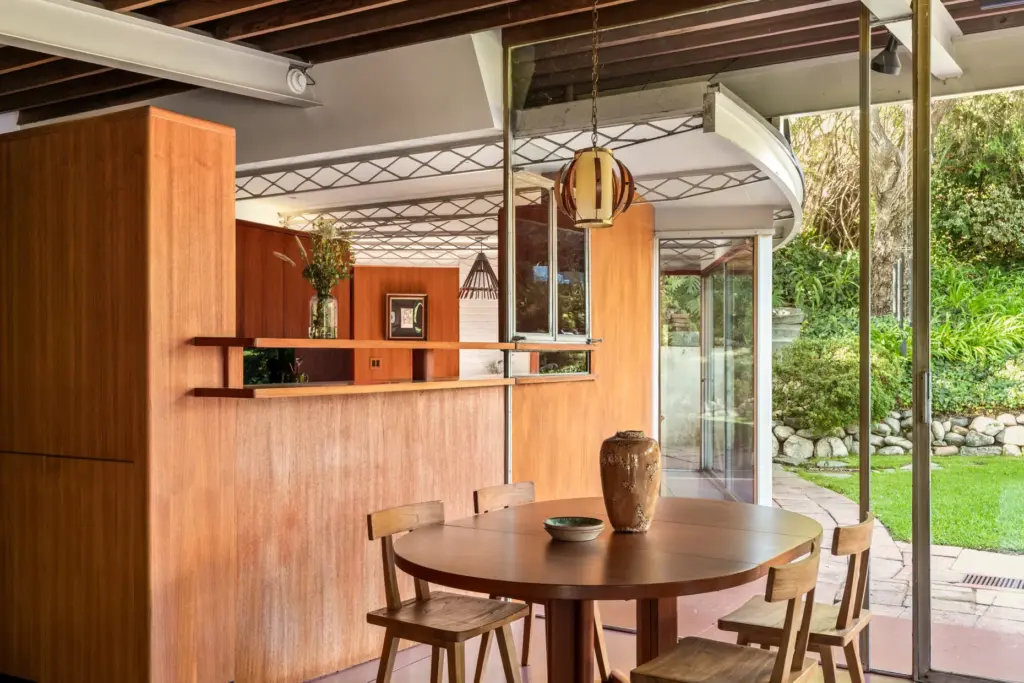 The dining area offers a glimpse of the kitchen beyond....