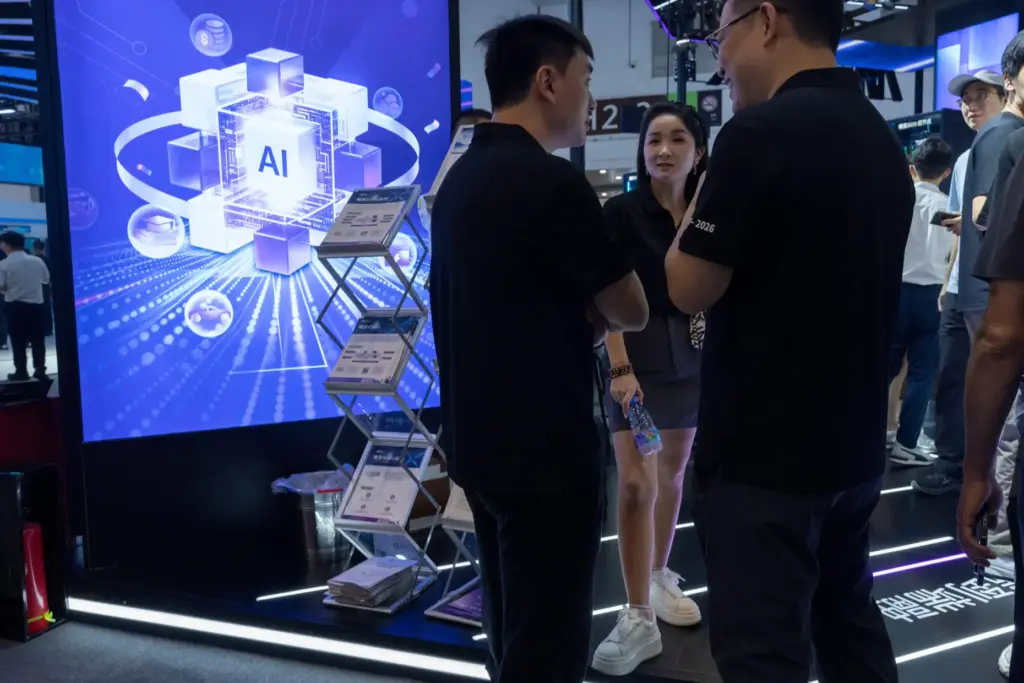 Visitors chat during the World AI Conference in Shanghai.