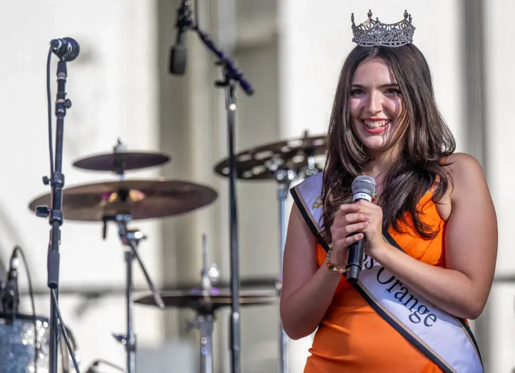 Kalista Brown, Miss Orange 2026, welcomes guests to the annual...