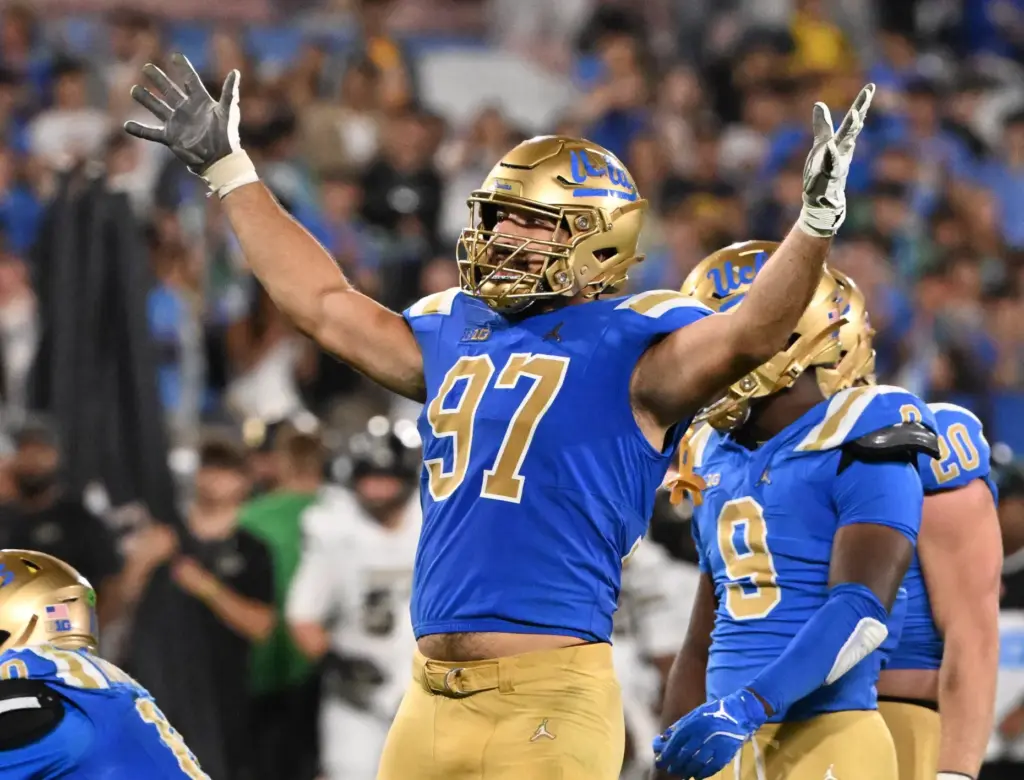 Defensive lineman Aiden Gobaira (97) of the UCLA Bruins reacts...