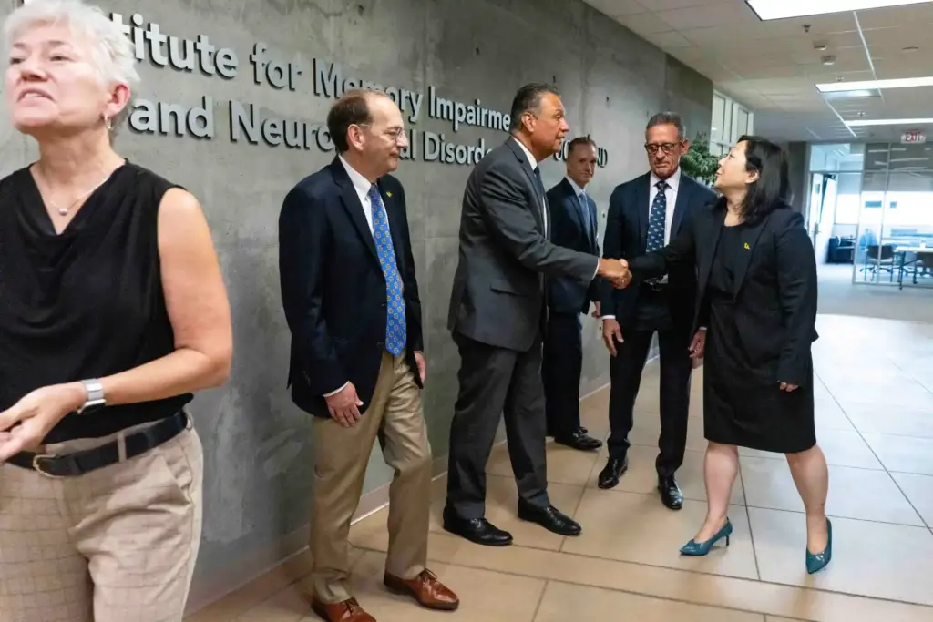 Sen. Alex Padilla shakes hands with Assistant Vice Chancellor Sherry...