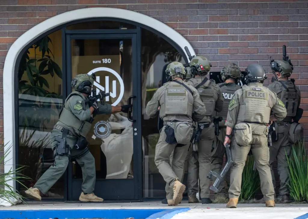 A West County SWAT team moves into position to search...