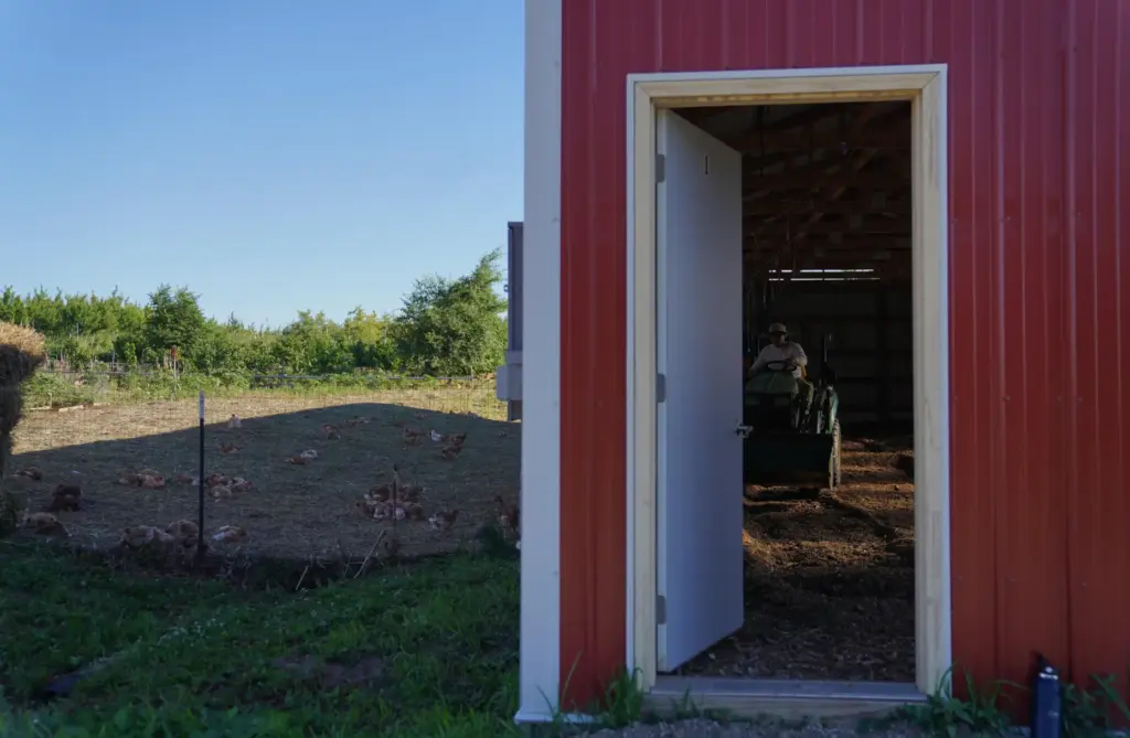 Carlos Rosales, director of research and development at Salvatierra Farms, flips the bed of a paddock.