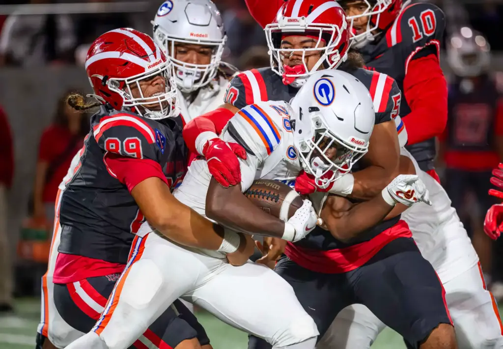 Mater Dei defensive lineman Viliami Sisifa, left, and defensive lineman...