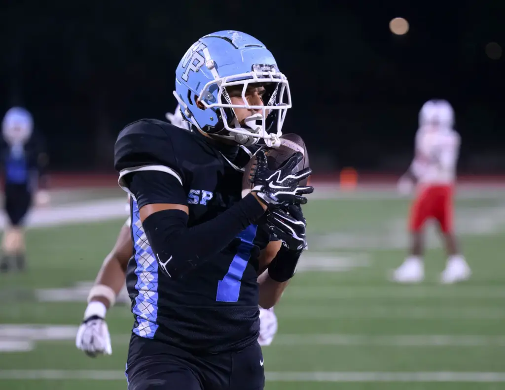 Villa Park wide receiver Alex Samuel catches a pass in...