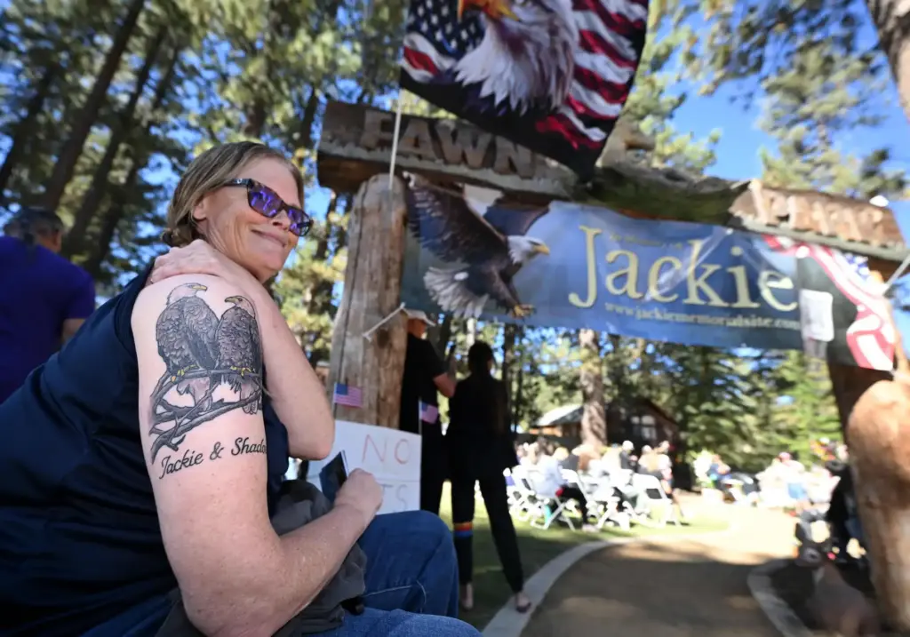 Kim Barfell, from Big Bear, shows off her tattoo of...