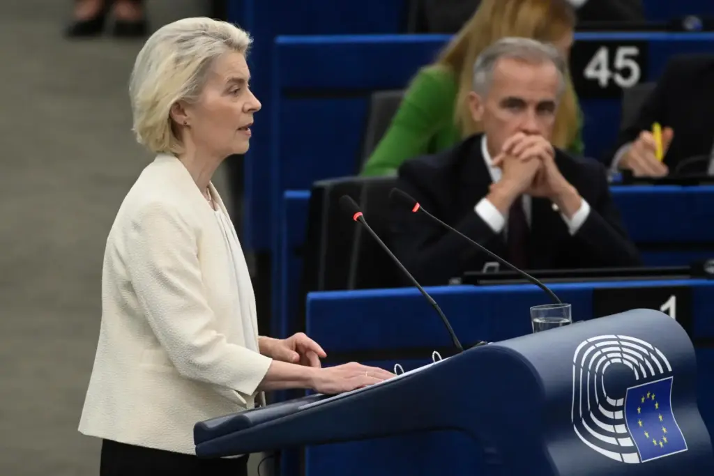 Canada's Prime Minister Mark Carney listens to European Commission President Ursula von der Leyen.