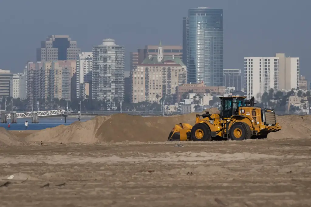 Crews continue to reinforce vulnerable portions of the Long Beach...