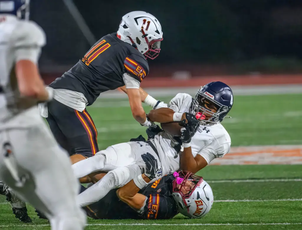 Trabuco Hills wide receiver Nate Davis is brought down by...
