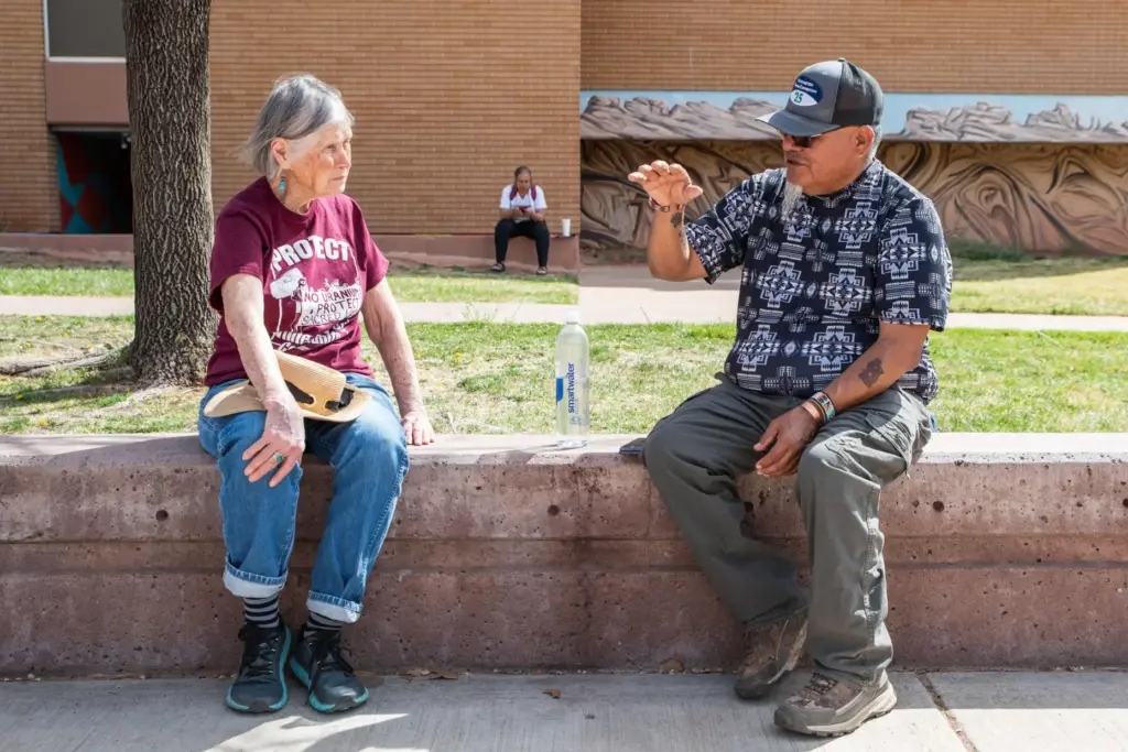 Malcolm Lehi speaks to Sarah Fields of Uranium Watch after a No Kings rally.