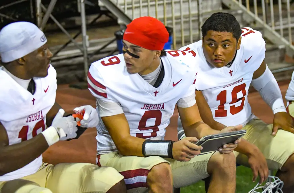JSerra quarterback Hayes Cloutier (9) with William Fredericksen (10) left,...