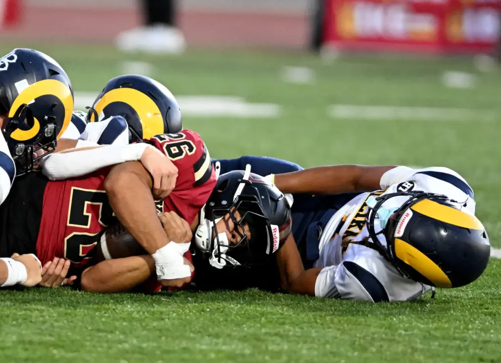 Downey running back Max Acosta (26) gets a first down...