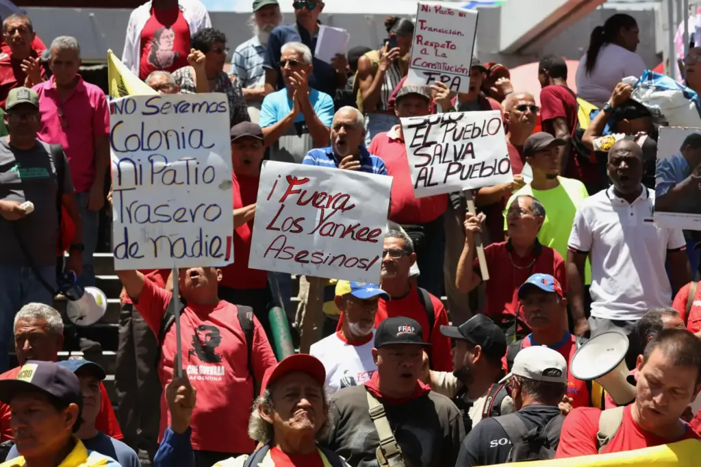 Venezuelans protest against President Donald Trump’s deal giving the United...