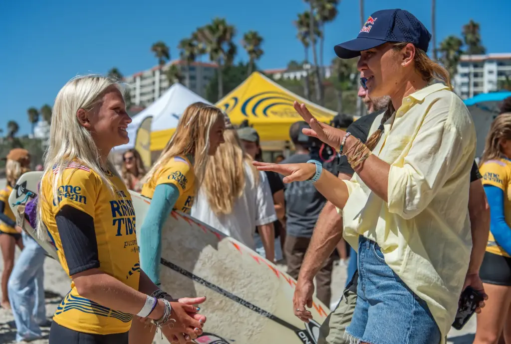 Carissa Moore, right, a five-time surfing world champion, talks with...