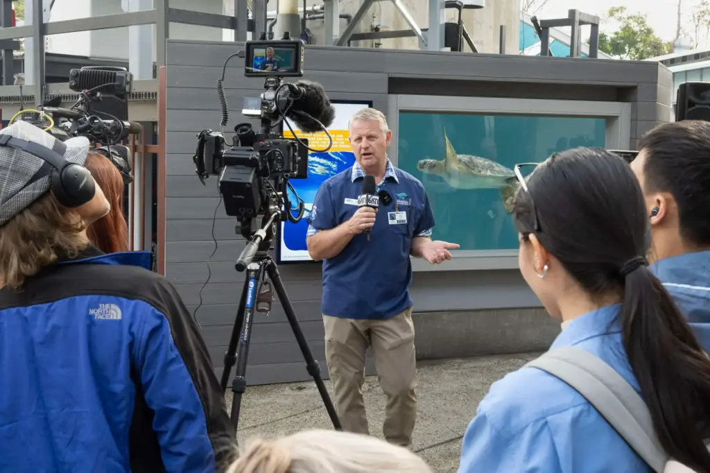 Veterinarian Dr. Lance Adams takes questions following the grand opening...