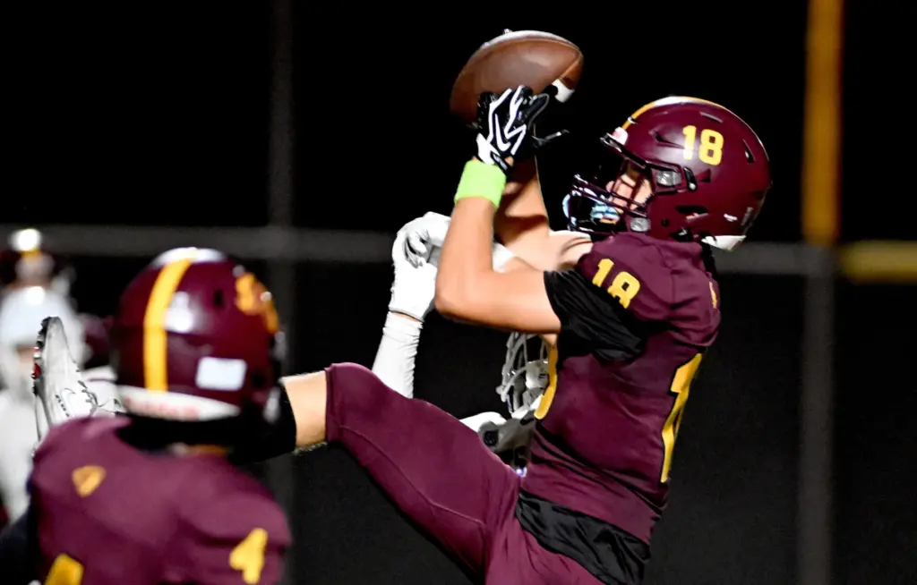 Valley Christian Defenders Eli Zotewey (18) makes a catch for...
