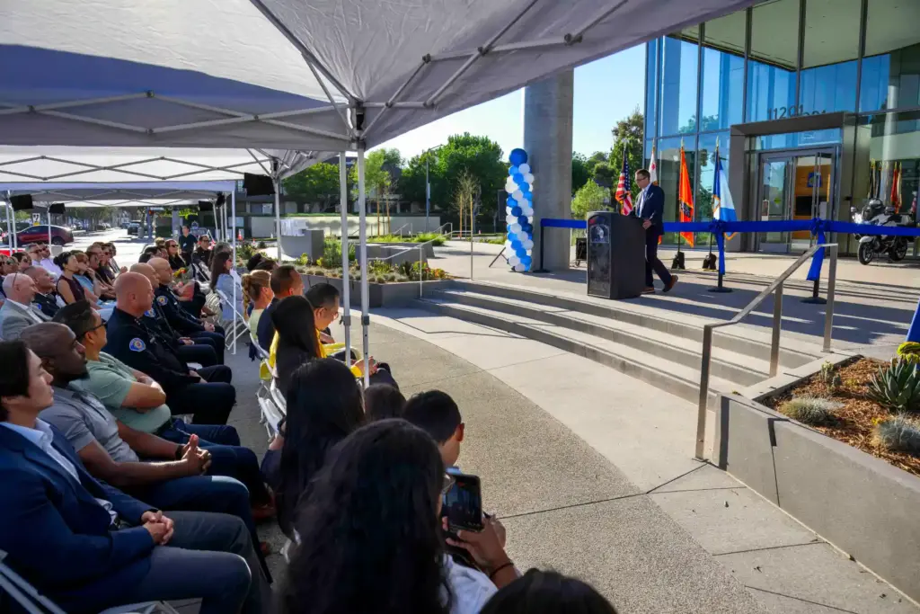 Guests attend the ribbon-cutting ceremony for the new Garden Grove...