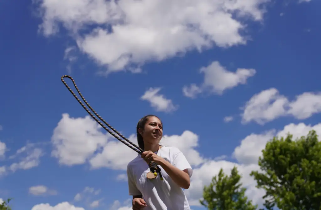 A guest practices rope meditation at Organic Compound's annual event.